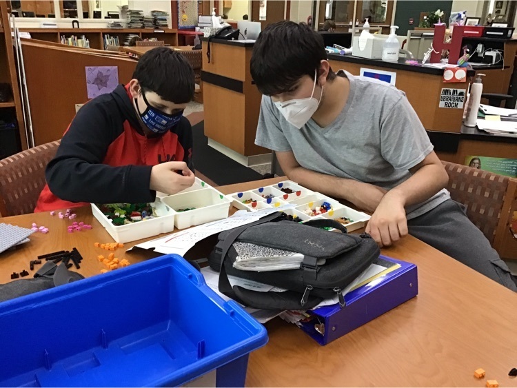 Students organizing kits.