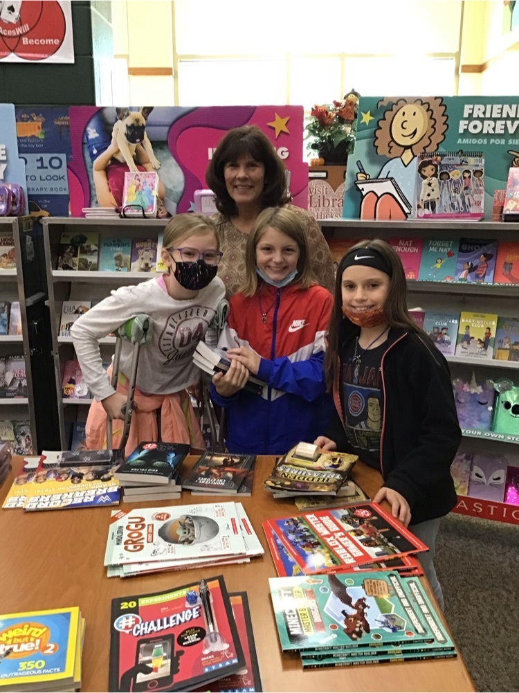 Mrs. Clinker and students at the Book Fair
