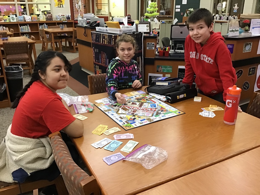 Students play a board game.